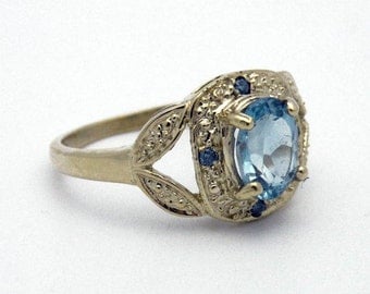 Sterling silver and aquamarine ring with 14K yellow gold trim