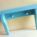 Rustic Turquoise Wood Wall Shelf with Peg Hooks