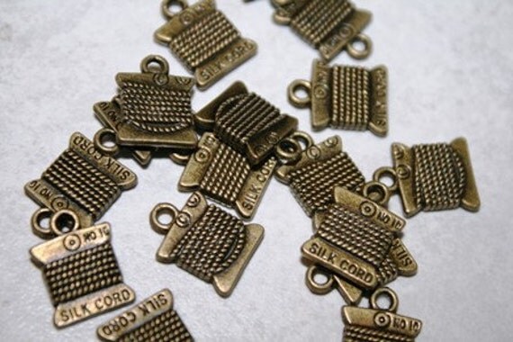 Crafting,  Cross charms cross Stitch Sewing,  Floss, Charms,  Embroidery, DMC Spool, stitch brass