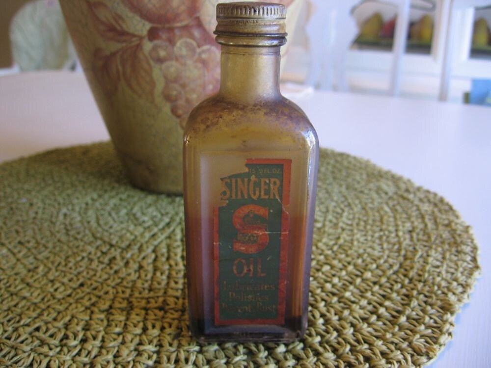 Vintage Singer Sewing Machine Oil in Glass Bottle Some Product