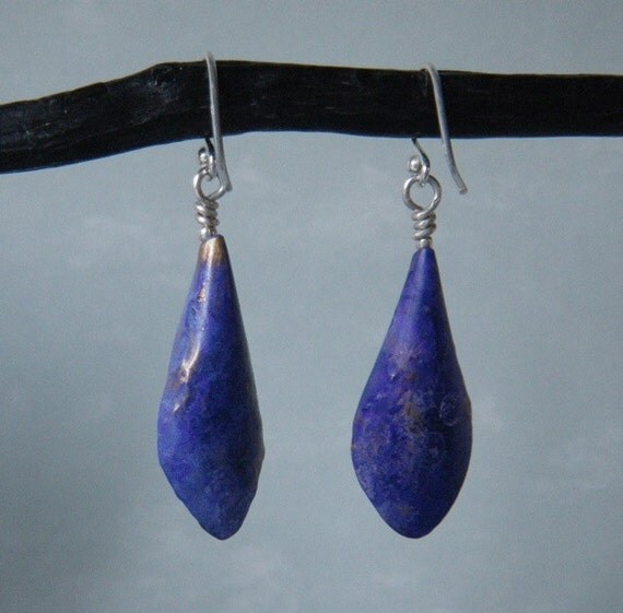 Brass earrings wearing purple passion