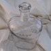 Clear glass antique bottle flask