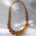 BLOW OUT SALE --- Vintage Graduated Amber Glass Bead Necklace