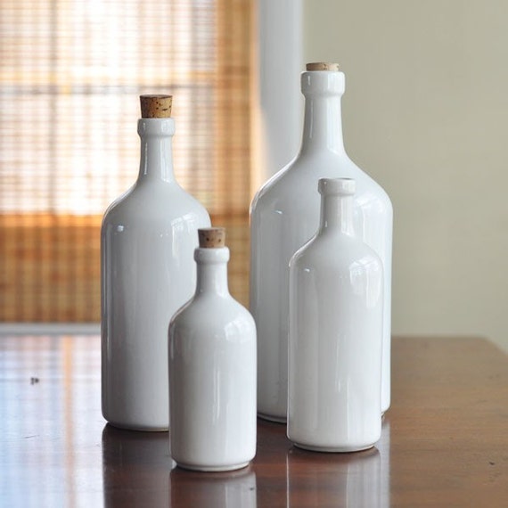 Items similar to Set of 4 Vintage White ceramic bottles on Etsy