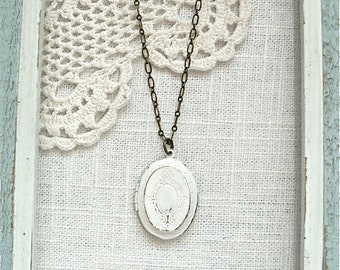 Weathered vintage style locket necklace. Antique white photo keepsake gift. Jewelry by Sweet And Simple.