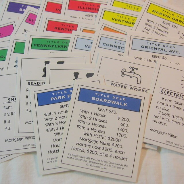 28 Title Deed Cards from Monopoly Deluxe Edition Game
