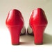 red and white spectator pumps