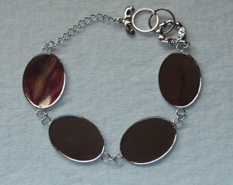 6 Silver tone bezel bracelets with four 25 x 18 settings