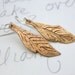SALE . golden feather dangle earrings . bronze talisman feather earrings . boho feather earrings by peaces of indigo