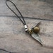 small golden snitch cell phone charm
