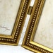 Two Hinged 4x6 Frames in Antique Gold