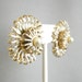 Vintage gold tone and white circular earrings with faux pearl center, clip on