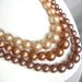 Vintage multi strand ivory, bronze, and brown faux pearl necklace