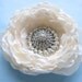 Large floral hair clip or sash pin with vintage rhinestone brooch center, sparkling flower