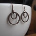 mod earrings in antique copper. modern earrings. copper earrings. circles. splurge.