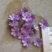 10 Vintage, purple lilac,enamel metal, flowers each approx. 12 - 13mm circa 1940's