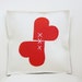 Herts felt pillow. white red.