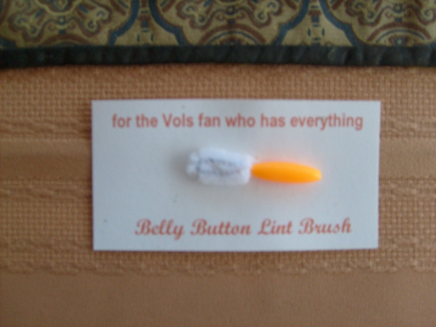 belly button lint brush for the person who has everything