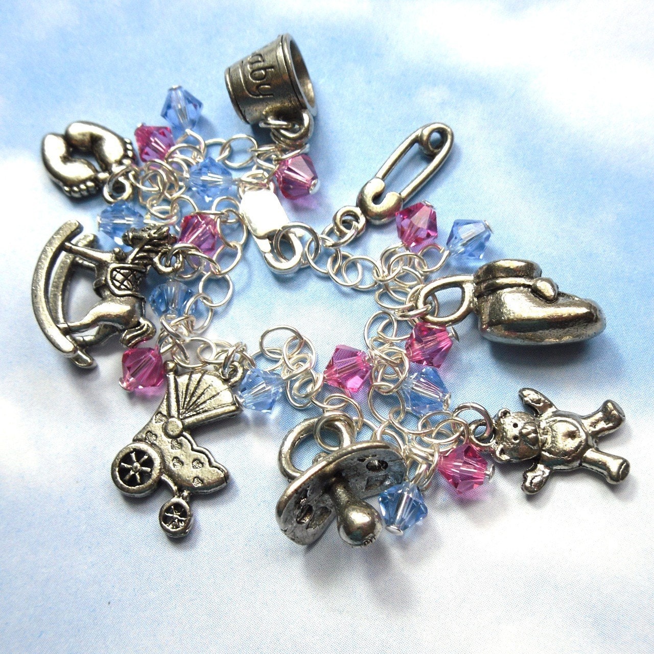 Baby charm bracelet nursery theme pink and blue crystals