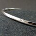 silver bangle bracelet with gypsy set ice diamonds either polished or darkened