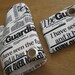 the NEWSPAPER oven mitt and pot holder set with an embodied magnet.