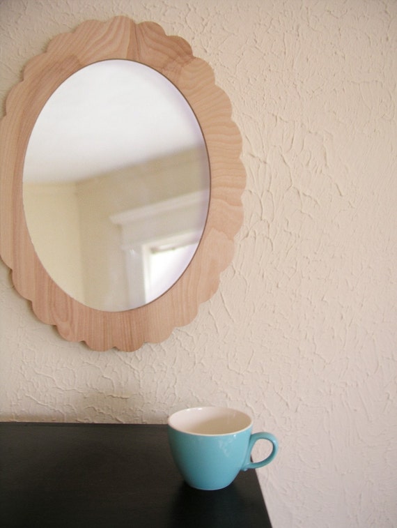 scalloped mirror in natural wood