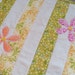 Sunkissed Quilted Table Runner with Appliqued Flowers