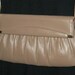 Small taupe leather flap bag with long goldtone chain strap