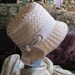 Light taupe beige wide woven raffia casual hat with grosgrain band and bow