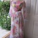 Romantic floating ankle length gown with pastel flower bouquets and sheer sleeves size 14