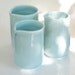 Set of 3 Wheel Thrown Porcelain handle-less pitchers with blue delicate glaze