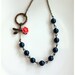 Dragonfly Garden. An Oxidized brass Dragonfly, Coral Flower, and Dark Blue Swarovski Pearl Necklace. For Her. Mom. Bridesmaid Gifts.