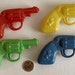 ONE HUNDRED Vintage1960s Soft Plastic Cowboy Six-Shooter Squirt Guns