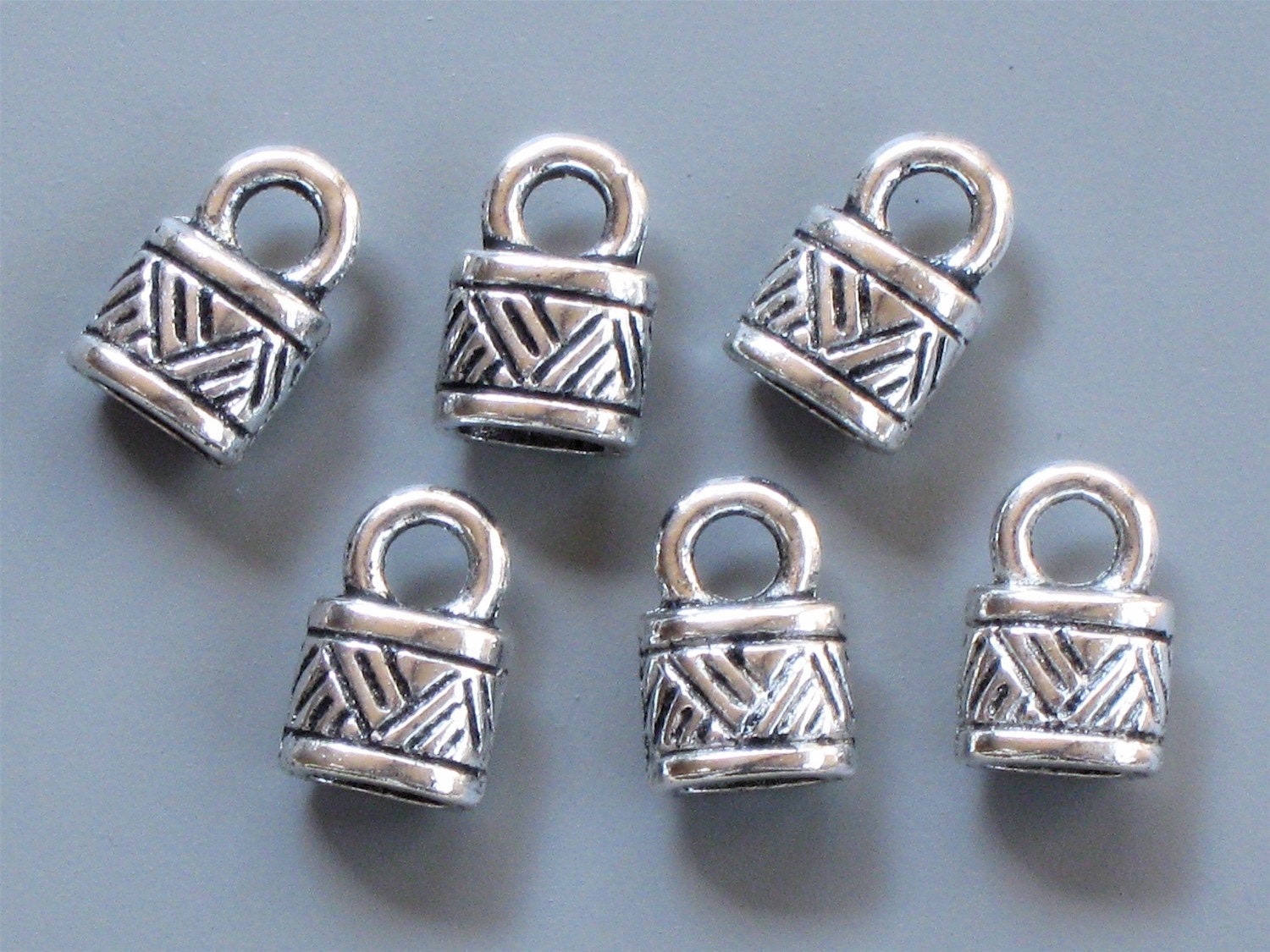 8 silver oval jewelry END CAPS with loop . Perfect for