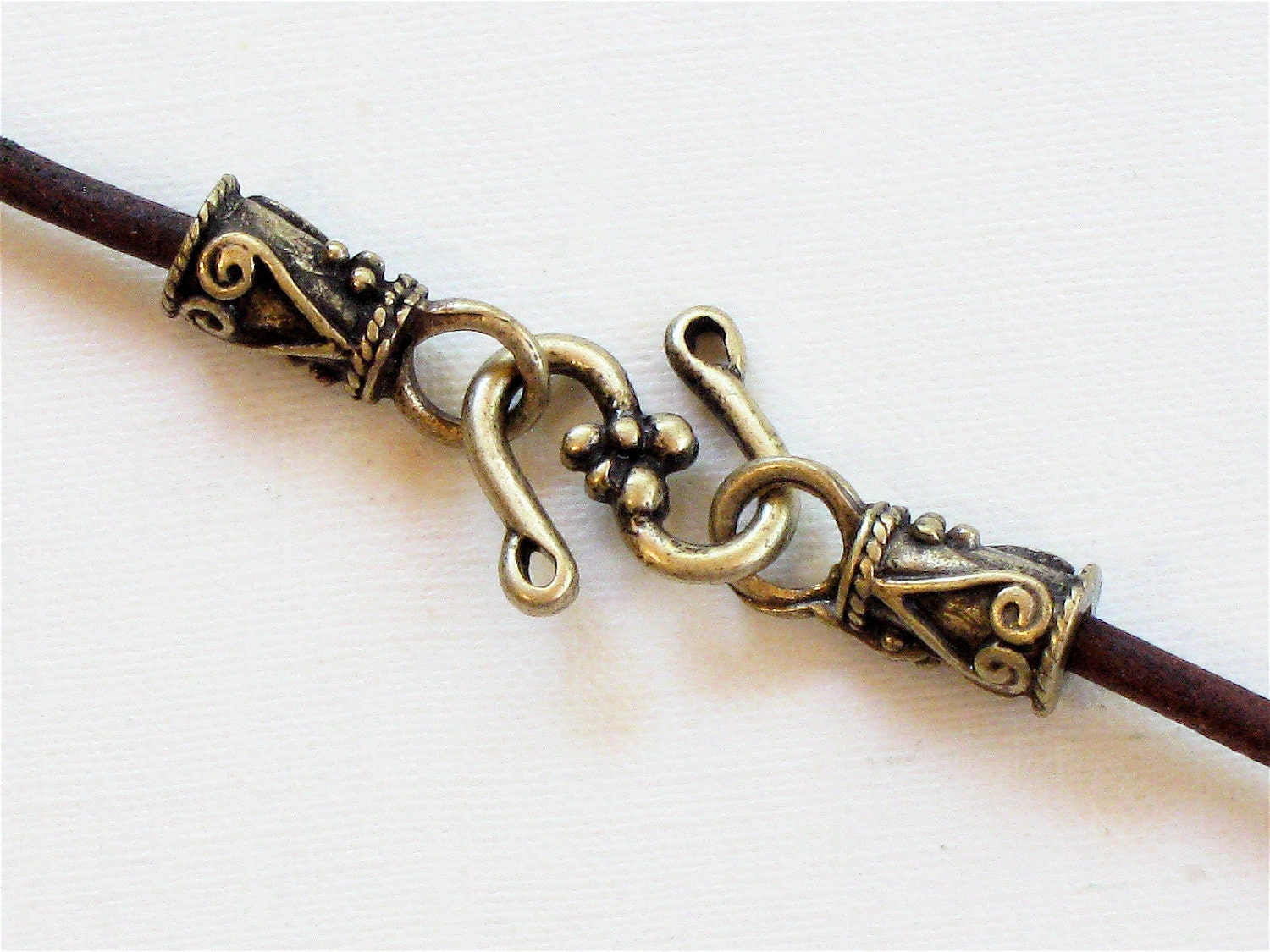 20 sets of jewelry End Caps and S Hooks for leather . Antique