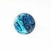 Round blue green paua shell ring in shiny silver adjustable crown setting