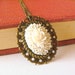 White rose flower necklace. Casual chic jewelry. Romantic. Floral. Mounted on antique brass.