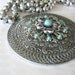 Vintage Aluminum Medallion with Flower Turquoise Accents Large Circle