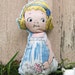 stuffed doll with blue minkee back