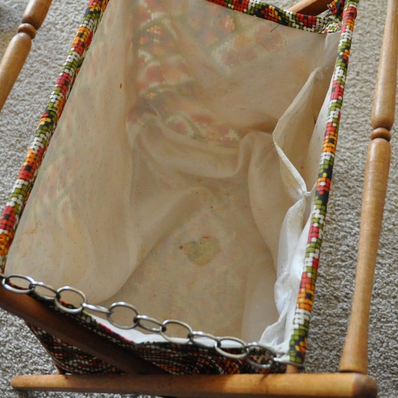 vintage sewing or knitting basket on wooden stand