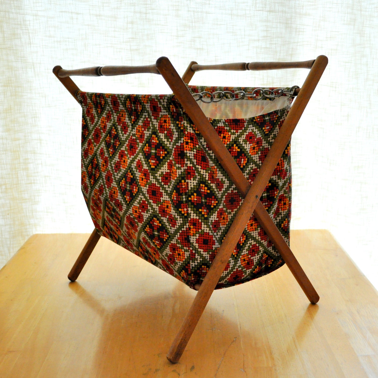 vintage sewing or knitting basket on wooden stand