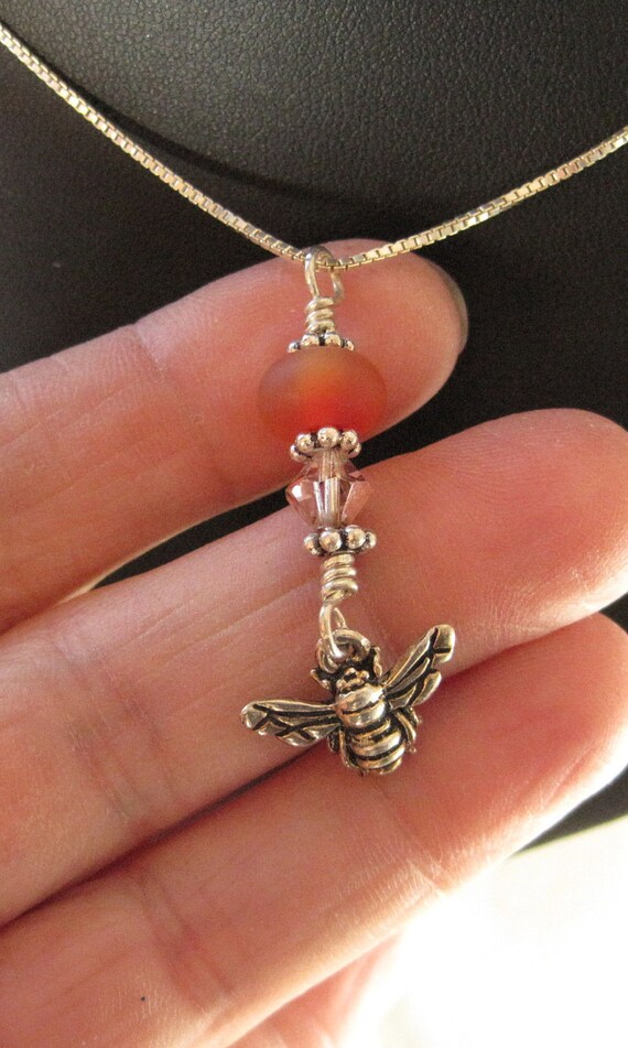 Items similar to Orange red glass bead with silver Terra cast vintage