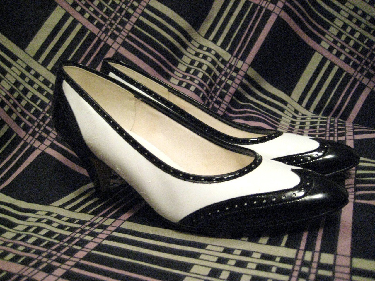 black wingtip heels