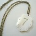 Lucky Seven Necklace. White shell necklace on antiqued brass chain. Do you feel lucky...