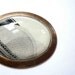 Large statement necklace with vintage black and white drawing on an oval pendant setting.