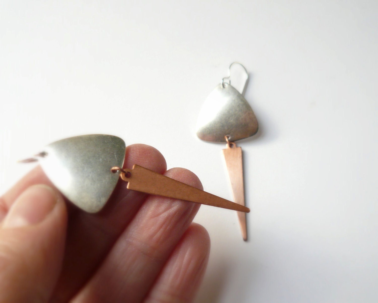 Silver earrings. Copper arrow with silver shield on sterling