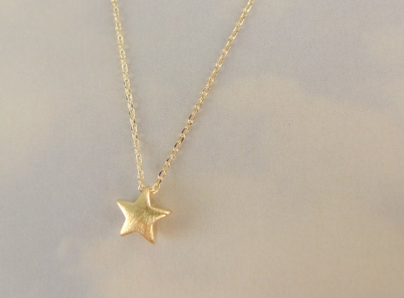 Items similar to gold star necklace on Etsy