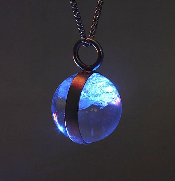 Pools of Light rock crystal orb encased in silver pendant