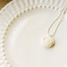 Maddux - Cream rosette necklace