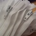 Twenty five White 7 inch YKK zippers